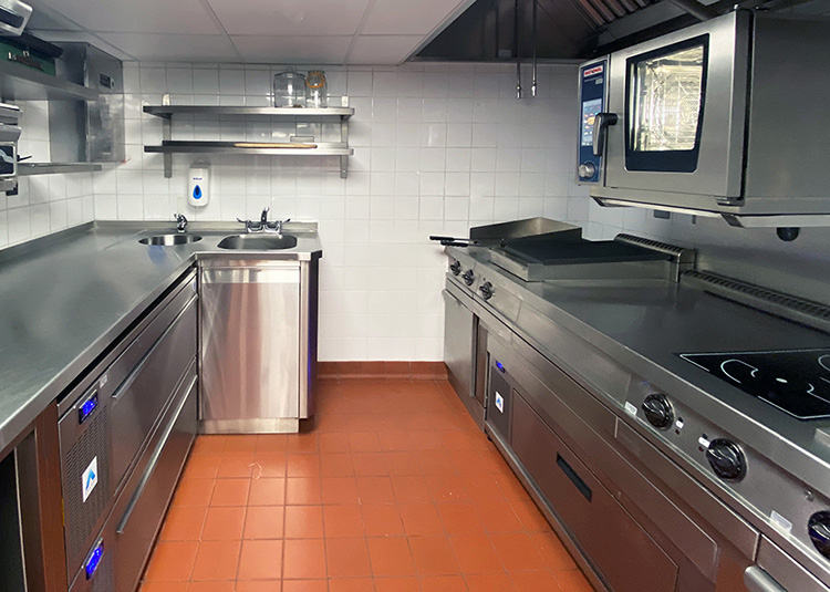 Confined, small kitchen at The Dorchester Bar Kitchen